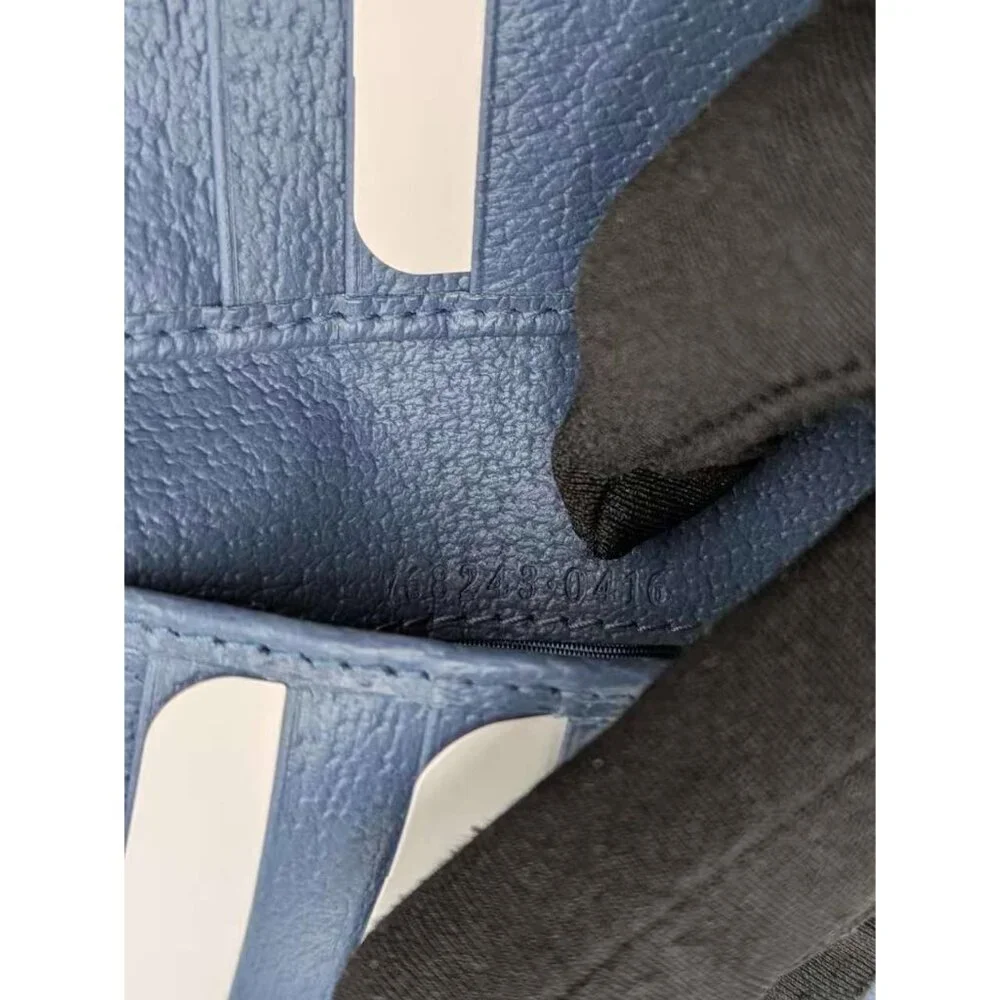 Gucci Black GG Supreme Bi-Fold Wallet with Blue Double G